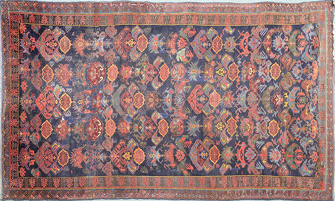 Antique Shirvan Carpet (10.75' X 6.5'): This antique Shirvan comes from the area known as the Caucasian region. This region now encompasses Armenia, Azerbaijan, Georgia, & Russia. The people of this mountainous region are well known for car