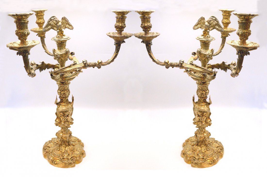 Charles Stuart Harris Antique Sterling Candelabras: A Pair of Victorian Silver Gilted Four Flame Candelabras made by the famous English silversmith Charles Stuart Harris in London 1897 in Very Good Condition. The two Eagles on the top have been done in
