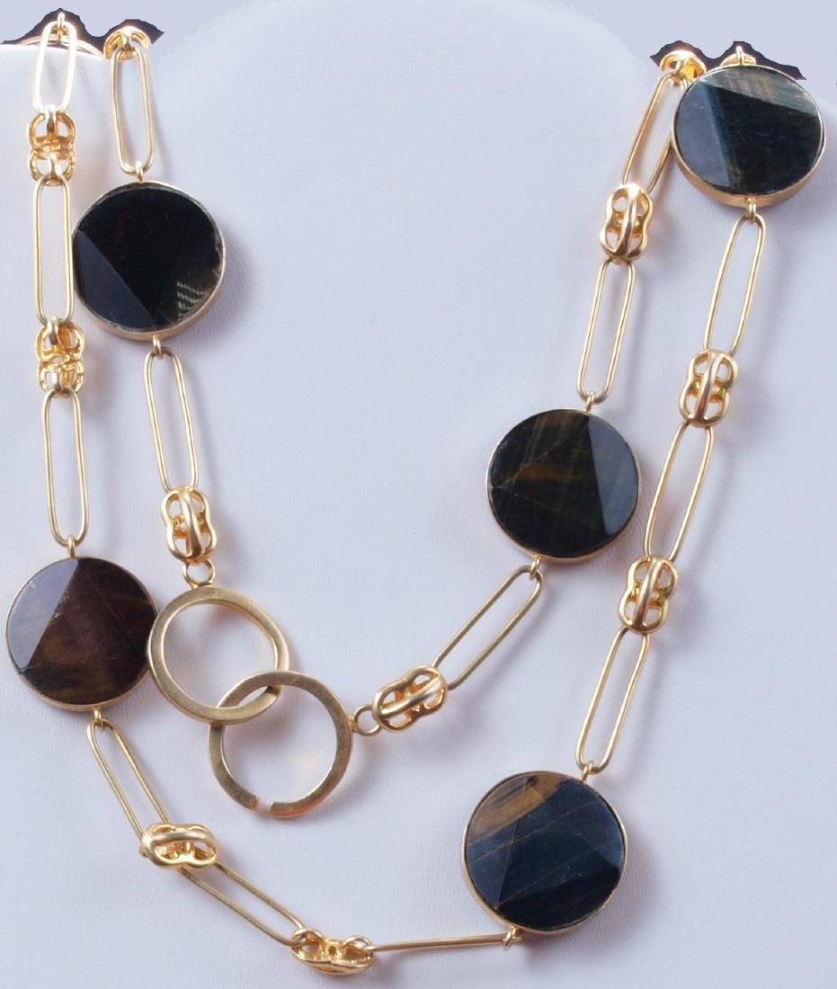 Italian Tiger Eye Gilded Silver Necklace: An antique A. Brand Italy Tiger Eye and Silver Gilded Necklace with 10 discs measuring 26 mm wide of tiger eye. This elegant necklace measures 50 inches (128 cm) long and weighs 5.017 ounces (143 gram