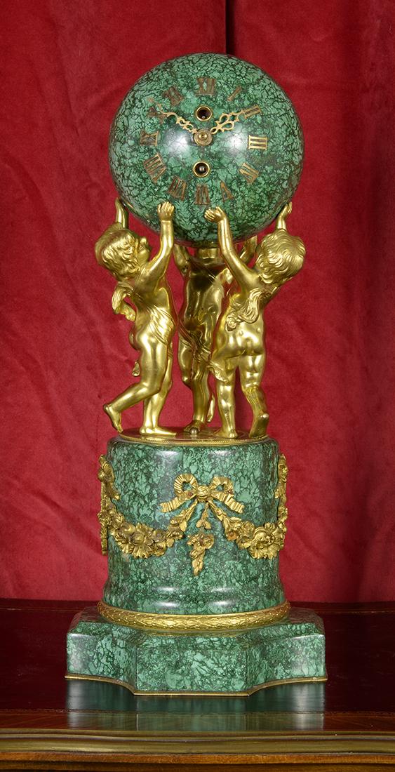 Antique French Vincenti & Cie Malachite and Bronze: This is an antique French clock from Vincenti & Cie, a well known French watch company. Made during the 19th Century and measuring over 14 inches in height, this clock is a wonderful antique that repr