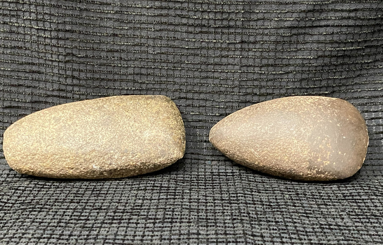 (2) Native American Stone Axe Heads: (2) Native American Stone Axe Heads | (1) Measures 4 1/4 L x 2 1/2 W x 1 1/2 D | (1) Measures 5 L x 2 5/8 x 1 5/8 D