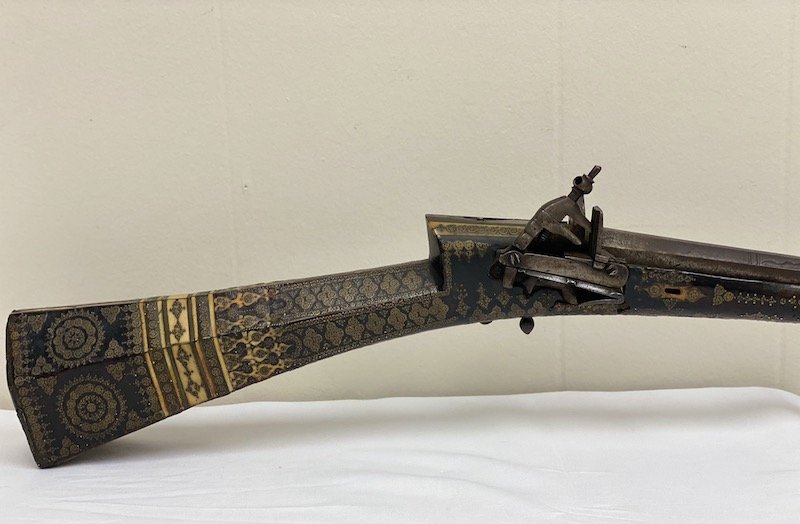 Islamic Turkish Flintlock Miquelet Rifle: Islamic Turkish 18th / 19th Century Flintlock Miquelet Rifle | Figured Wood Ornamental Design with Six Pointed Stars, Inlaid Bone with Brass Mounts having Islamic Motifs | Tapering Hexagonal Barrel | 