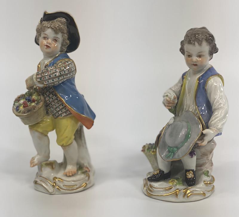 Pair Early 19th Century Meissen Porcelain Figurines: Meissen Porcelain Figurines Pair Two Boys - One Seated has major damage - One Standing has some small damage to fruits in basket and left side of rim. One measures 5 1/8 H and the other measures 4 1/2