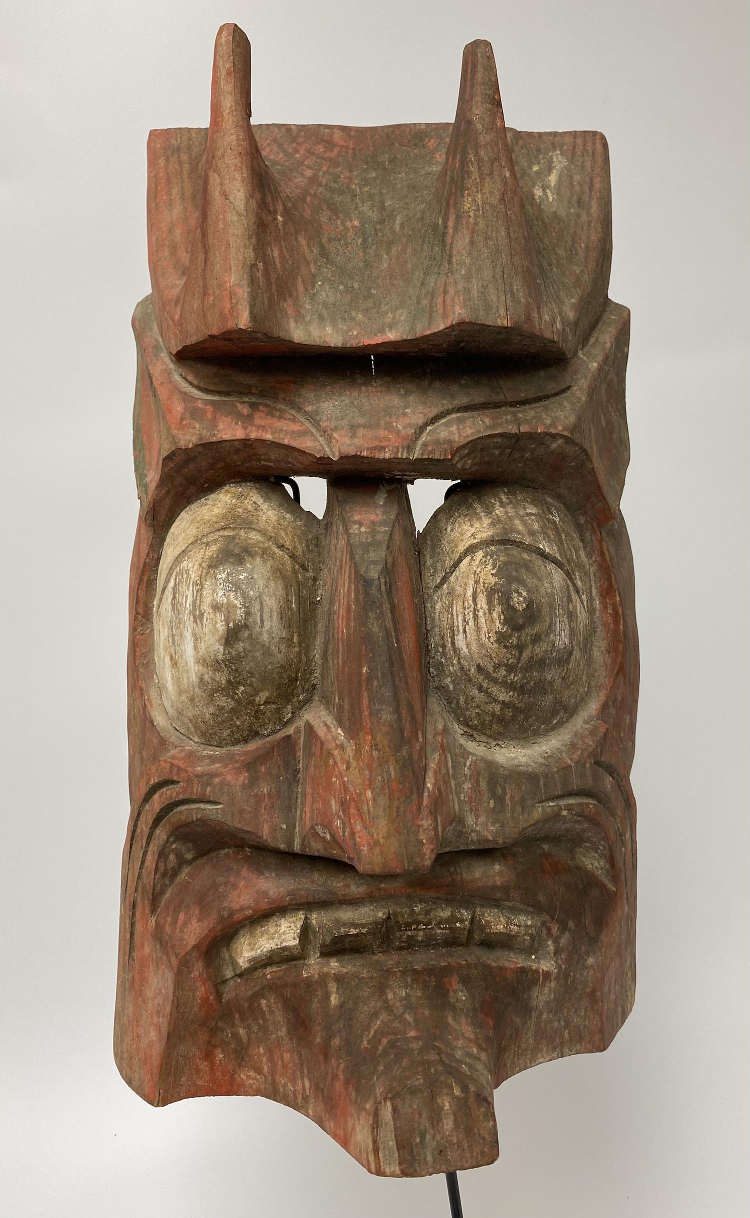 Large Mexican Devil Mask: Large Aztec Mexican Devil Mask - Red Face with White Bulging Eyes and Teeth. Measures 18 3/4 H x 9 1/2 W