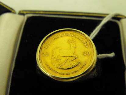 1/10 oz Gold Krugerand Ring: Gold Ring, Set with a 1/10 oz Gold Krugerand. 10.7g Total Weight. Age Appropriate Wear, Please see photos for a better idea of condition.