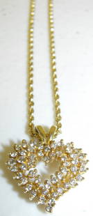 14K Gold & Diamond Heart Pendant Necklace: 14K gold & diamond(tested) heart pendant necklace. 11 1/2" long when worn. Age Appropriate Wear, Please see photos for a better idea of condition.