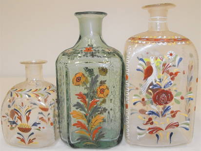 Lot 3 Antique Stiegel German Decorated Glass Bottles: Lot 3 antique Stiegel type German decorated glass bottles. Good condition overall. 6 1/2" tallest. Age Appropriate Wear, Please see photos for a better idea of condition.