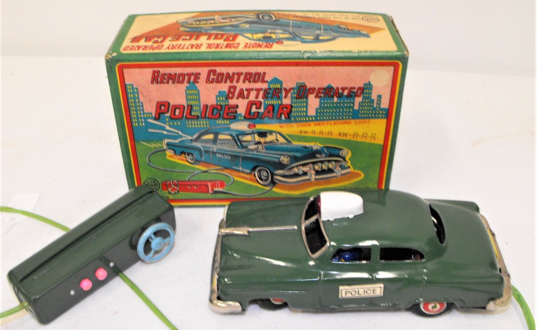 Linemar Battery Operated Police Car Tin Toy MIB: Linemar battery operated tin toy police car in original box. Very good condition. 8 1/2" long, 3 3/4" wide. Age appropriate wear, please see all photos for a better idea of condition.