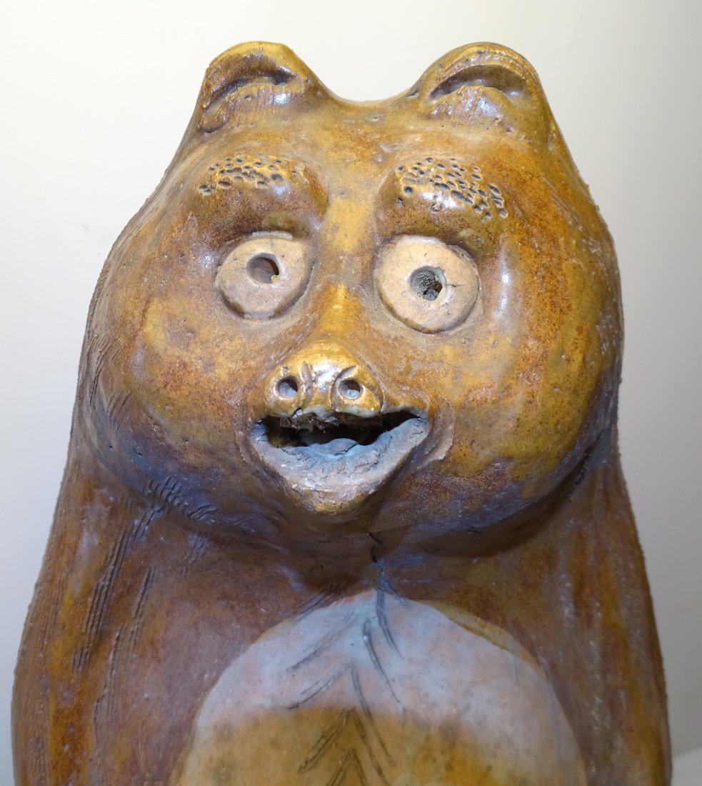 Large Folk Art Redware Bear Figural Container: Large redware bear lidded container. Measuring 29" tall and 12" wide. Nice folky look. Some roughness around the edges as can be seen in the photos.