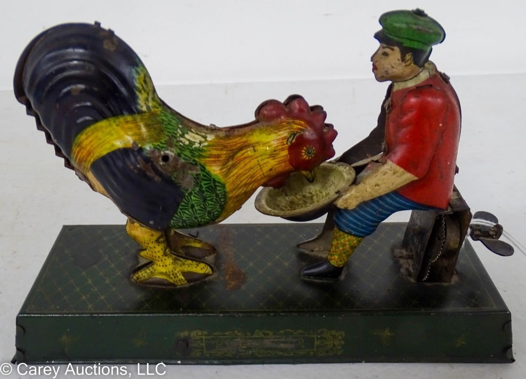TIN WIND UP MAN FEEDING ROOSTER TOY (1 of 3)
