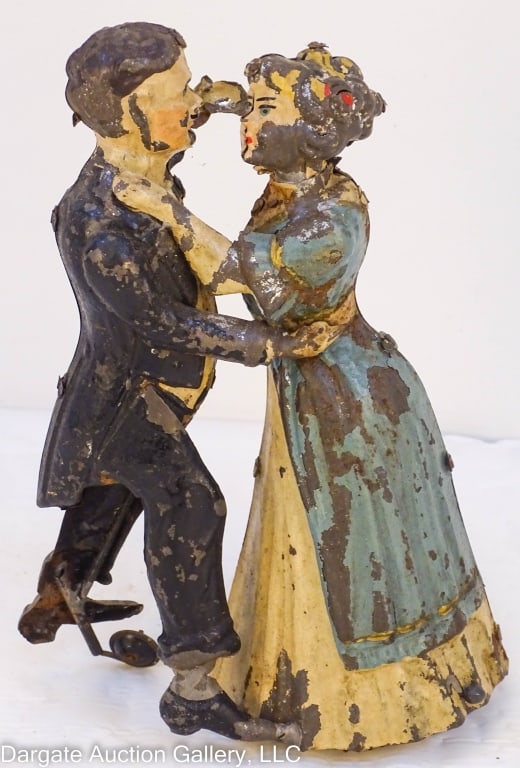 GERMAN GUNTHERMANN CO TANGO DANCER TIN TOY: GERMAN GUNTHERMANN CO TANGO DANCER TIN WIND-UP TOY WALTZING DANCING COUPLE WInd the key under the woman's dress, and the couple dances in random patterns. / Measures: 8"H / Condition: Paint loss, key