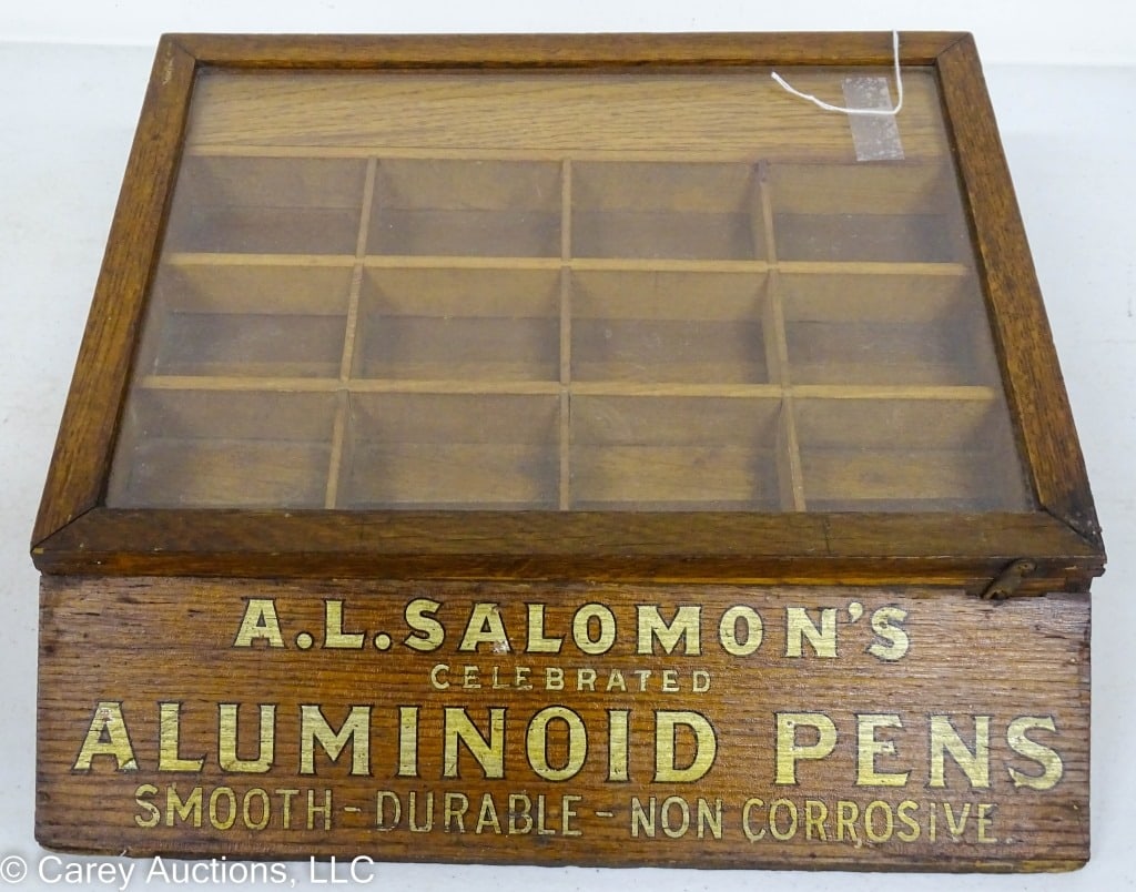 OAK DISPLAY CASE FOR A.L. SALOMONS ALUMINOID PENS: Nice oak Country Store Counter Top Display Case Advertising A.L. Salomon's Aluminoid Pens, Glass lid lifts, draw in back / Measures: 5"H x 13.75"L x 13.25"D / Condition: Very nice condition with nice