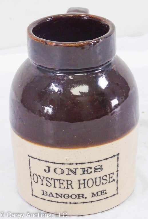JONES OYSTER HOUSE BANGOR MAINE STONEWARE JAR: A petite, brown and white glazed oyster jar, stamped (Jones Oyster House Bangor, ME) / Measures: 5" x 3.75" / Condition: Faint 1.75" hairline from rim.