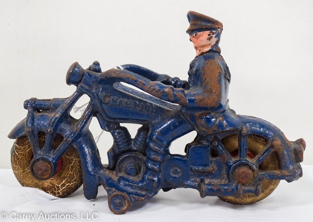 CHAMPION MOTORCYCLE POLICEMAN CAST IRON TOY (1 of 5)