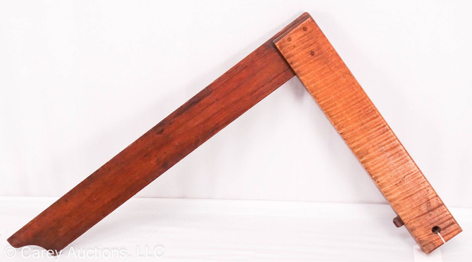 19th CENTURY TIGER MAPLE & WALNUT WOODEN BUILDER'S SQUARE: Very well made 19th Century builder's square made of walnut and tiger maple wood; mortised joint with wooden pin construction; the tiger maple side is 14"L x 2.25"W x 1.25" th