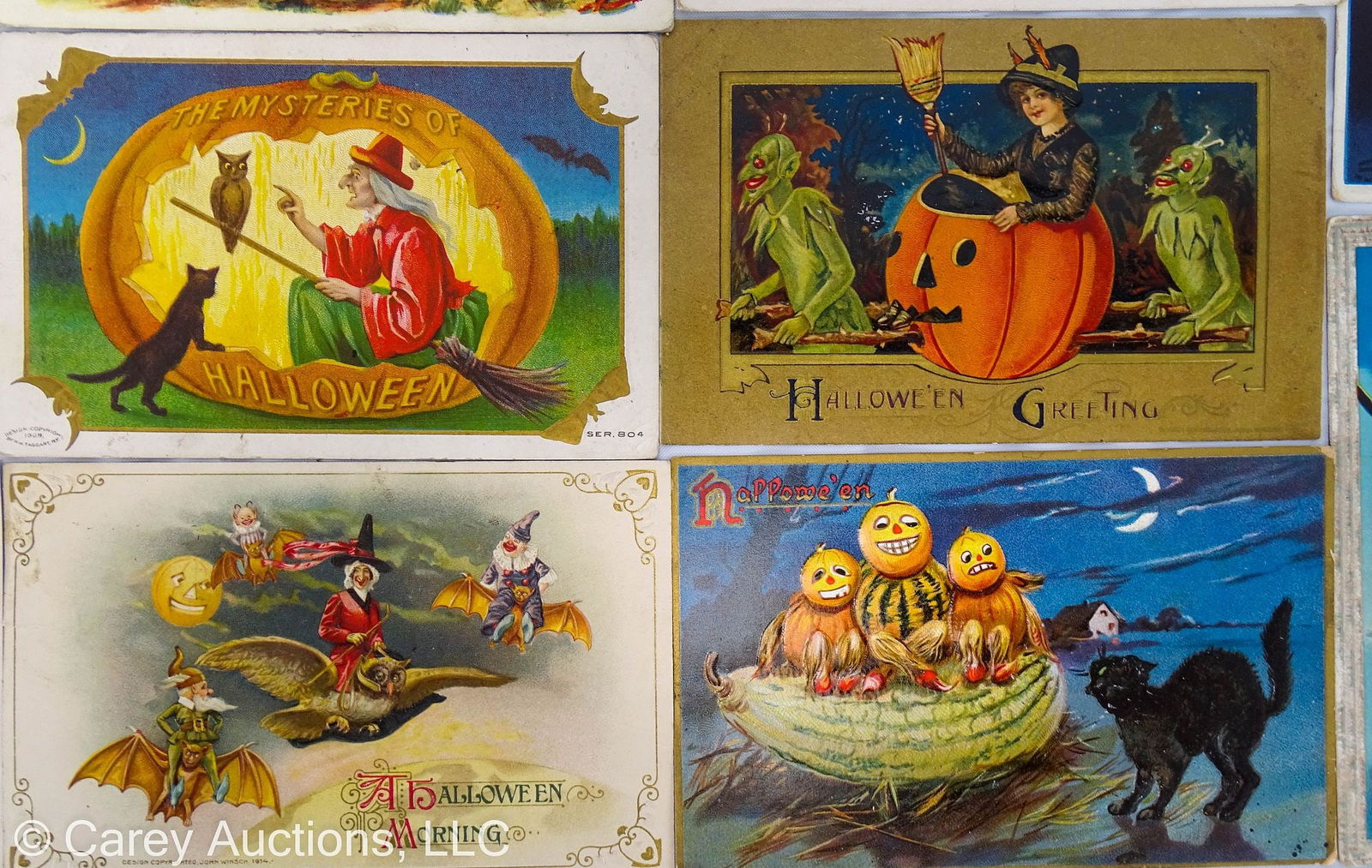 20 ANTIQUE EARLY 20th C HALLOWEEN POST CARDS: Includes: (1) Stretcher A witch with a broom, black cat and full moon; (1) 1908 Tuck’s Veggies people and black cat; (3) Ellen Clapsaddle Veggie people and JOL; (1) MW Taggart JOL, witch and bla