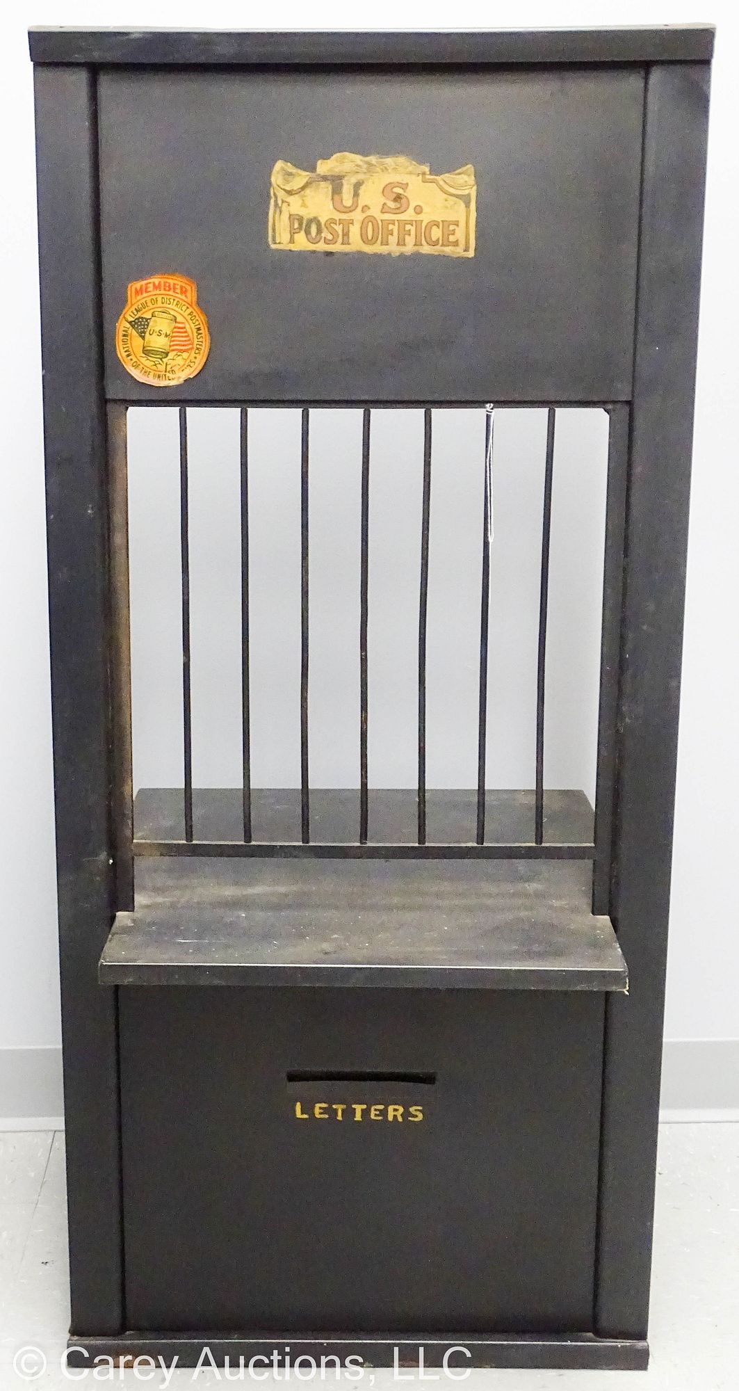 US POST OFFICE METAL CASH WINDOW MAIL BOX: A Metal US Post Office Window for a small country, maybe a in-home post office; has a barred window with drawers and cubby holes on the back side and a letter slot in the front below the shelf; this w