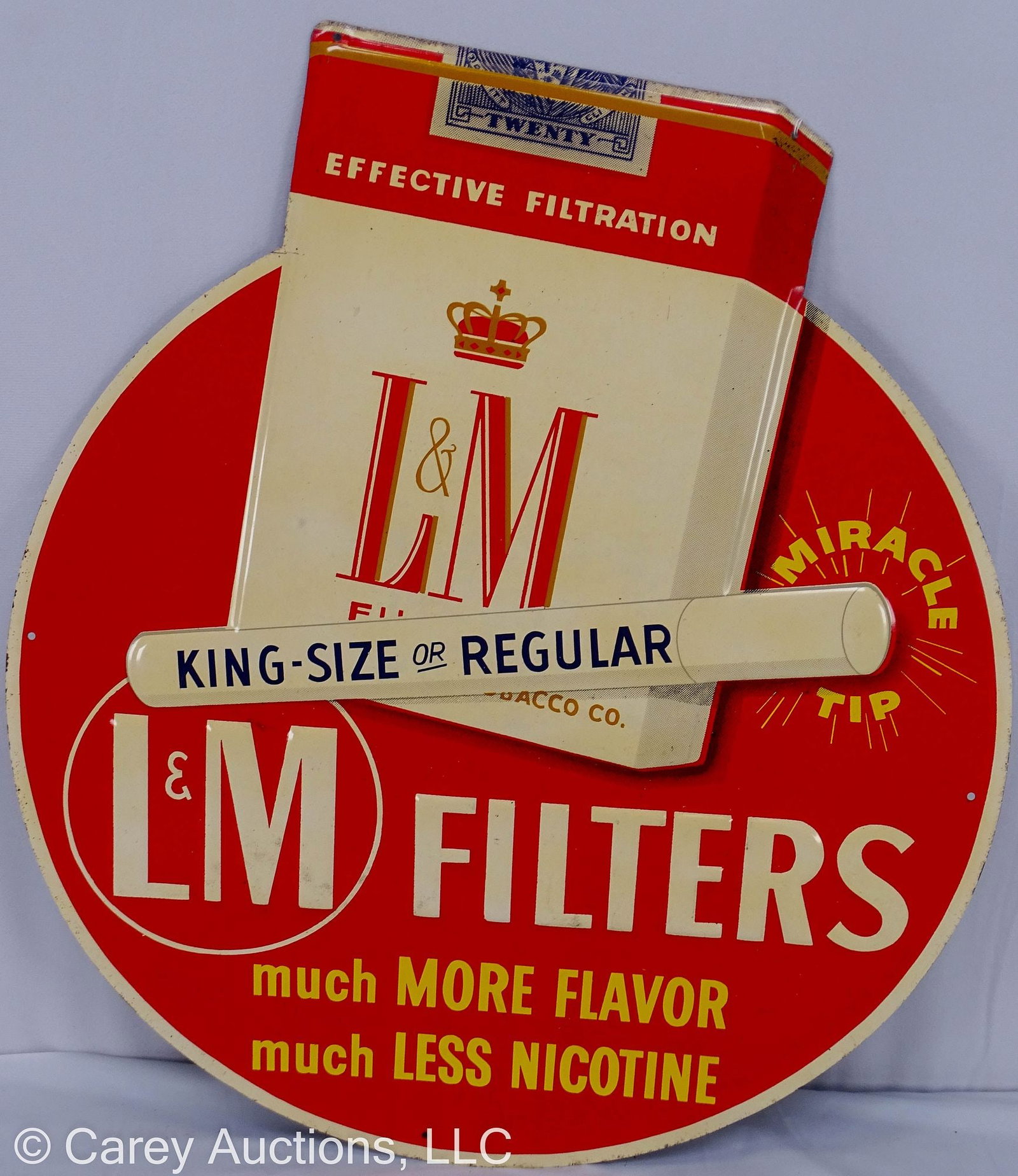 ROUND TIN LITHO L&M FILTER CIGARETTE ADVERTISING SIGN: Tin advertising sign for King size or Regular L&M filtered cigarettes [Much more flavor, much less nicotine]; embossed cigarette and pack // Measures: 21"H x 18.5"D // Condition: Light d