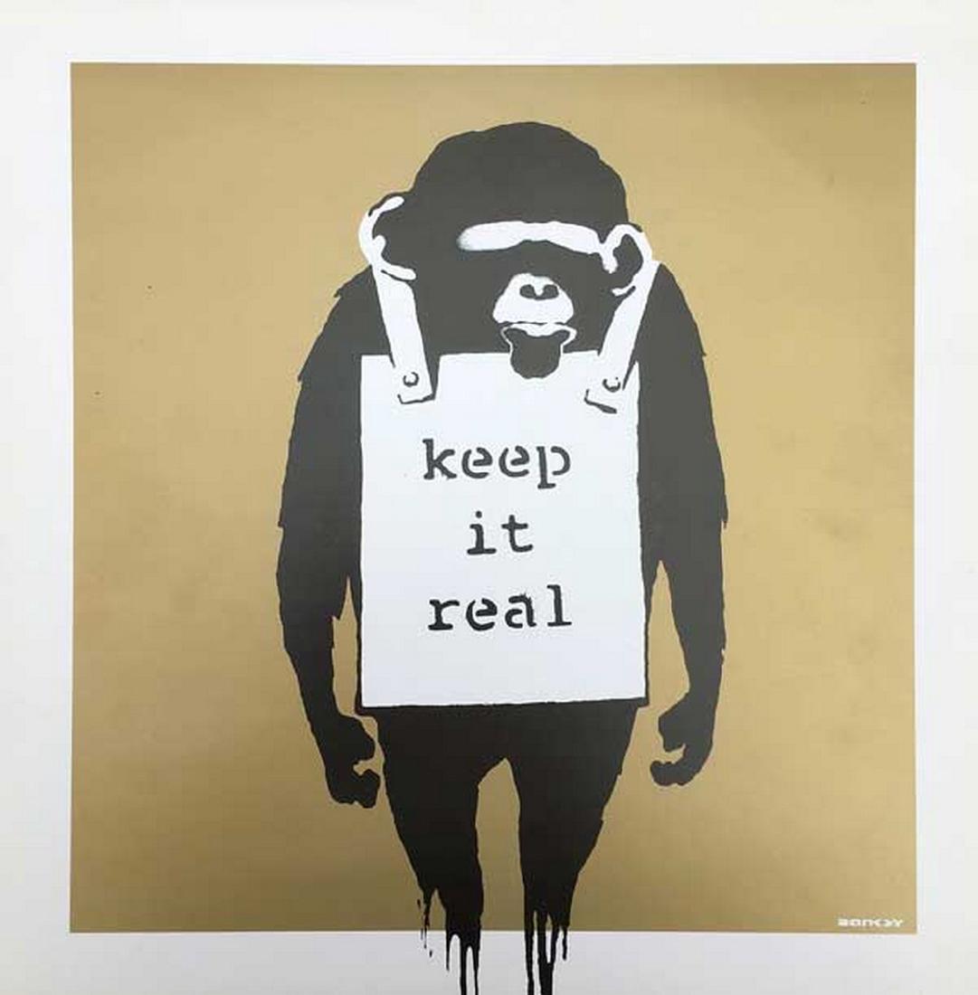 Keep it Real Gold - Banksy: Print on cardboard from 2008 Cover artwork by Banksy with Monkey. One side of the cover has ""keep it real"" other side ""Laugh now, but one day we'll be in charge"" hanging from the Monkeys neck. Tra