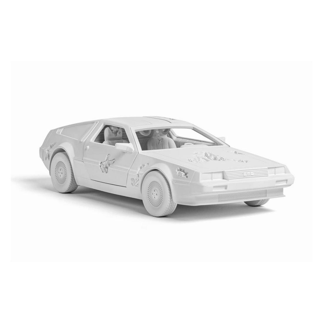 Daniel Arsham - ERODED DELOREAN: 2021. Resin, Plaster and Aluminium Oxide. Arsham studio. Limited edition of 500 . 31 x 14 x 8.5 cm / 12.2 x 5.5 x 3.3 in