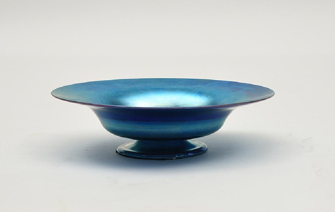 Tiffany blue Favrile art glass pedestal bowl: Tiffany blue Favrile art glass pedestal bowl, signed L.C. Tiffany Favrile 9.75"W. x 2.75"H.