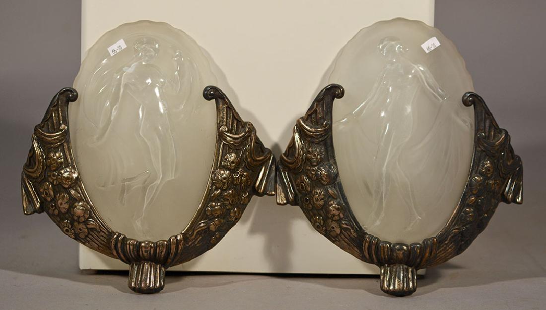 Muller-Freres Luneville Art Deco Wall Lights: Proper pair Muller-Freres Luneville Art Deco wall lights. Frosted panel with nude polished figure. Silvered bronze frames with deco floral and swag decoration. Glass panels with embossed signature in 