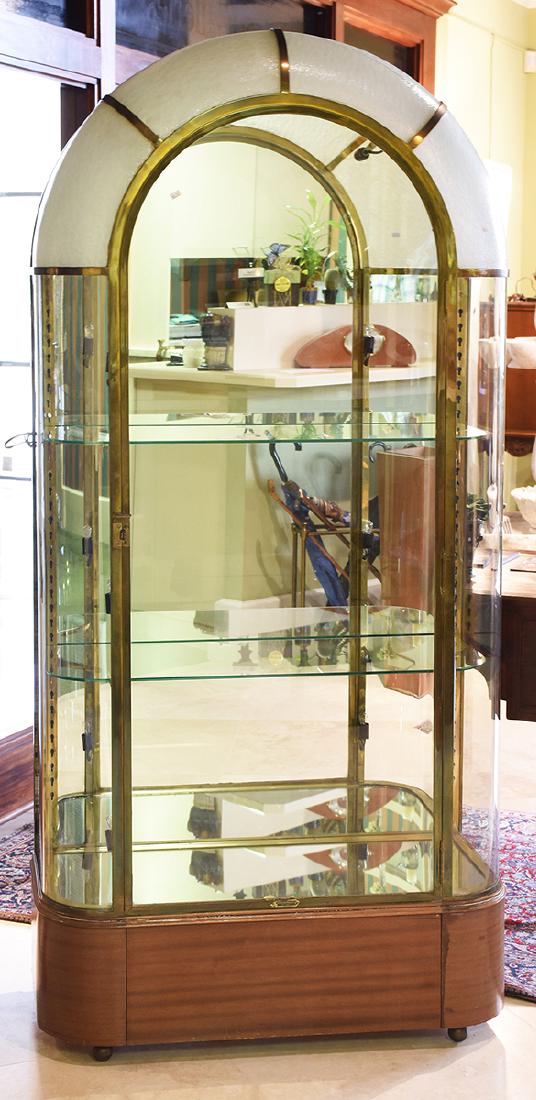 Fine French art Deco bronze and glass vitrine: Fine French art Deco bronze and glass vitrine, domed top with textured opaque glass, mirrored back, glass shelves, lighted, ca.1925, 76.5”H. x 35.5”W. x 15.5”D., brass tag “Del