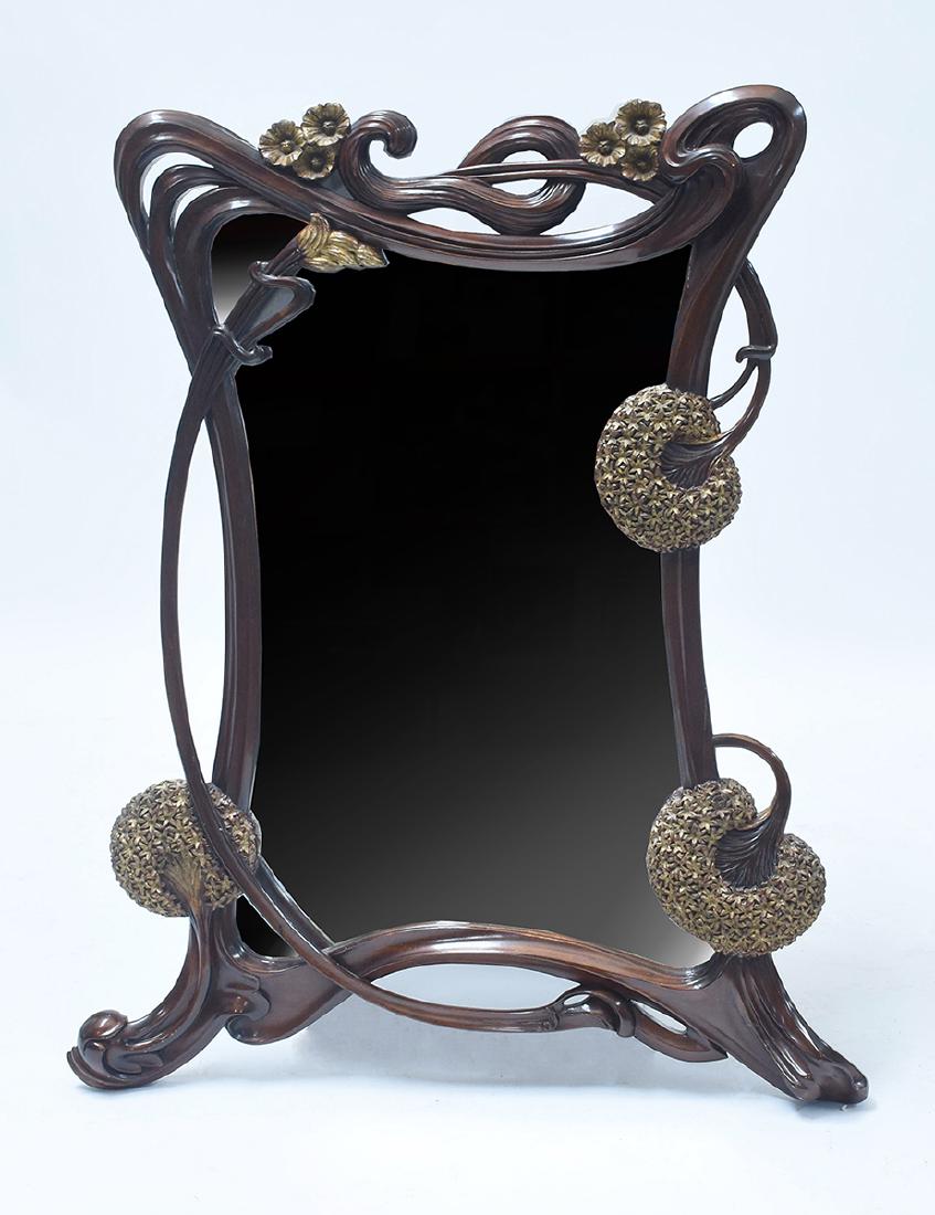Carved and gilt mahogany Art Nouveau style mirror: Carved and gilt mahogany Art Nouveau style mirror, carved dandelion seed pods and poppies, 47.5”H. x 39”W.