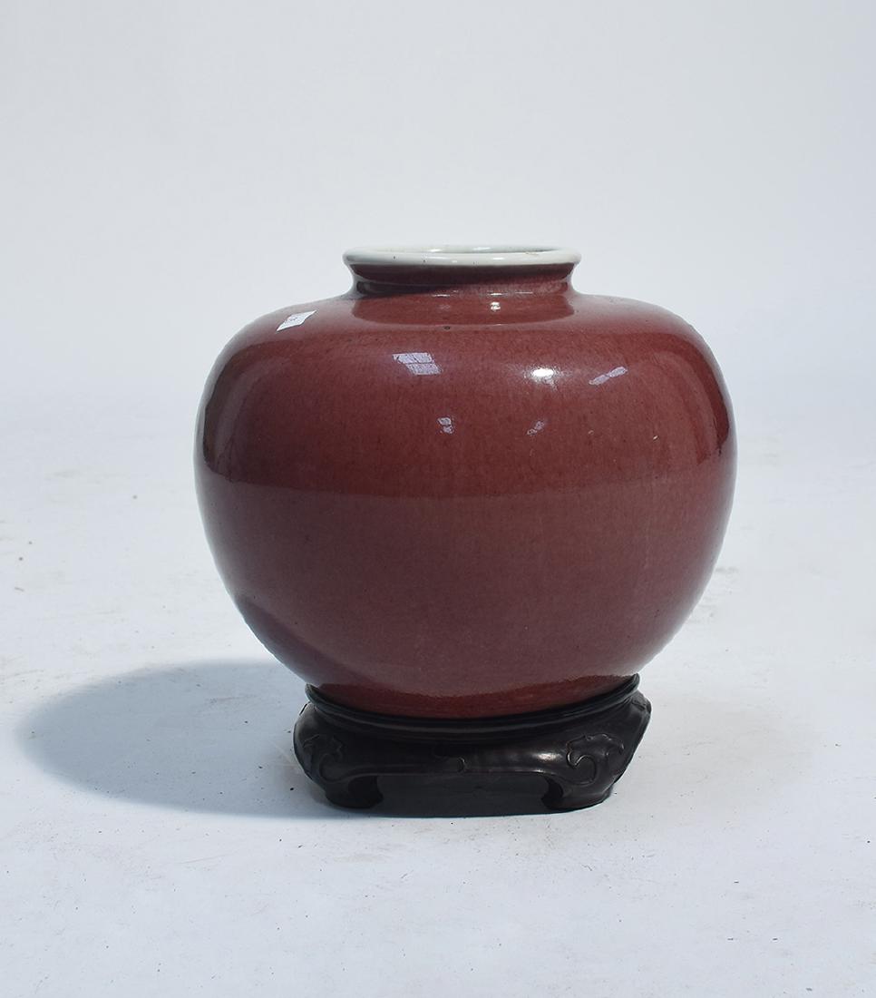 Chinese 19th C. Peach-Bloom vase on carved hardwood: Chinese 19th C. Peach-Bloom vase on carved hardwood stand, appears original, 7.5” x 10” W.