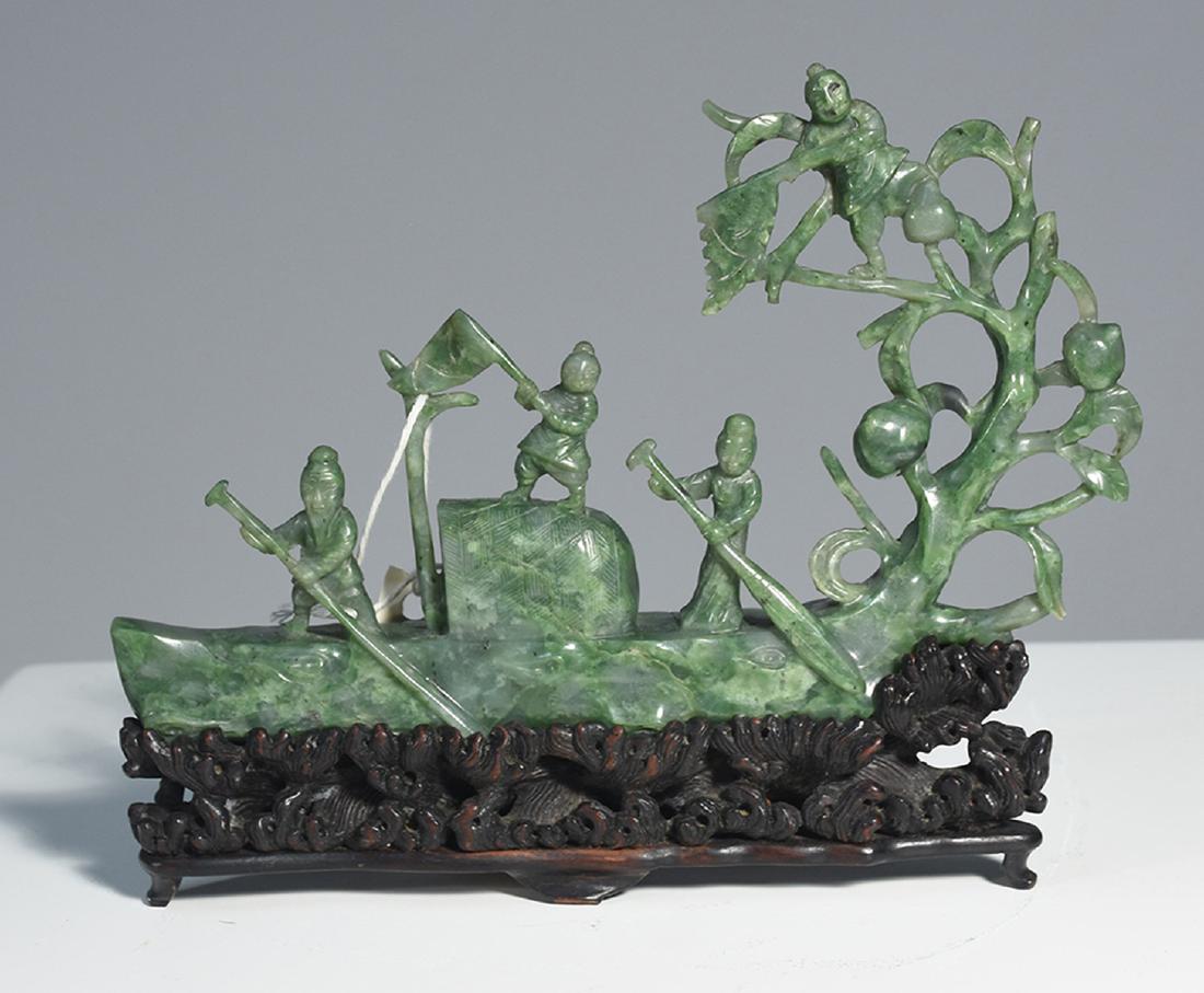 Chinese Republic period carved jade boat: Chinese Republic period carved jade boat with figures on interior, carved rosewood base resembles waves. Jade 5.5”H. x 8.5”L., 7”H. overall.