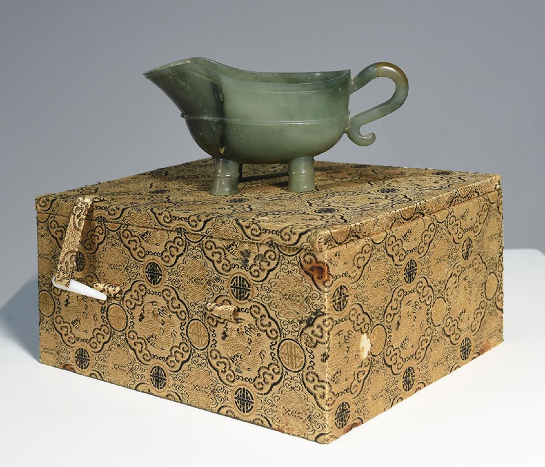 Republic period Chinese carved jade archaic form sauce: Republic period Chinese carved jade archaic form sauce boat, 5.75”W., in original fitted box.