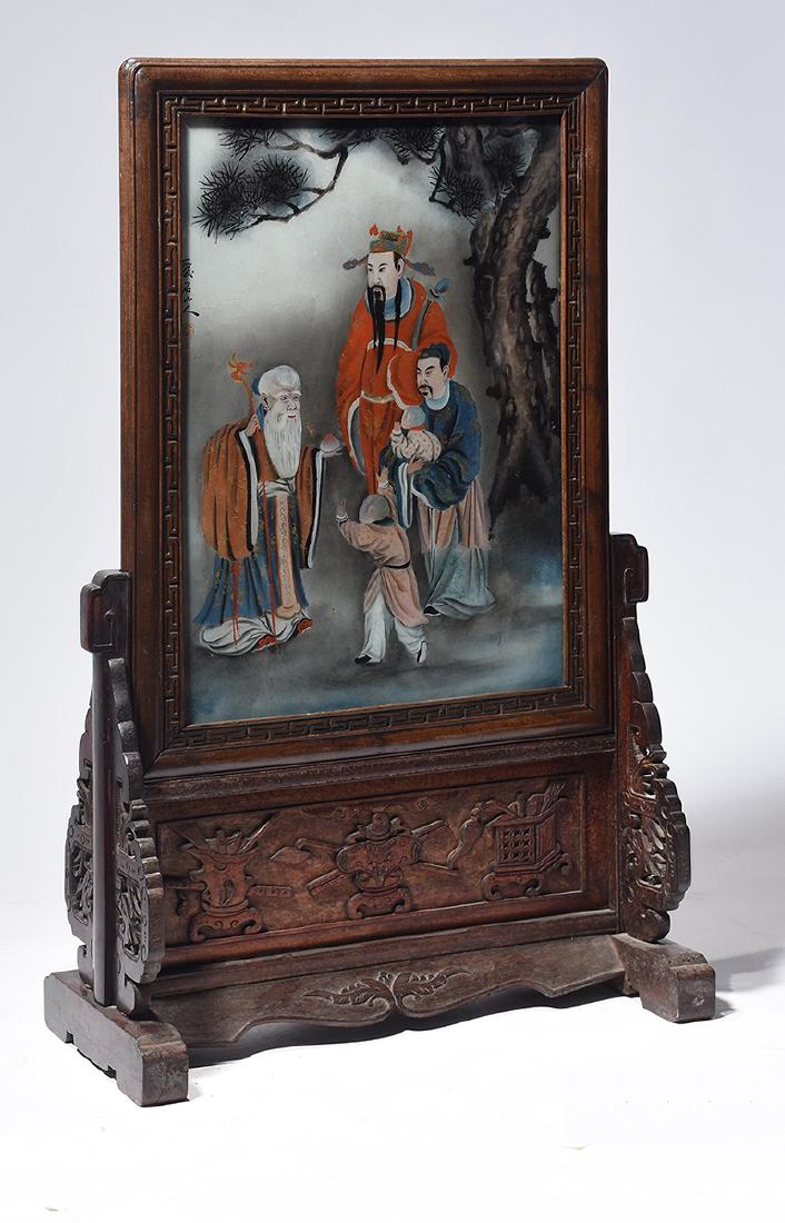 19th C. Chinese reverse painted table screen: 19th C. Chinese reverse painted table screen signed in a carved rosewood stand, 31”H. x 19”