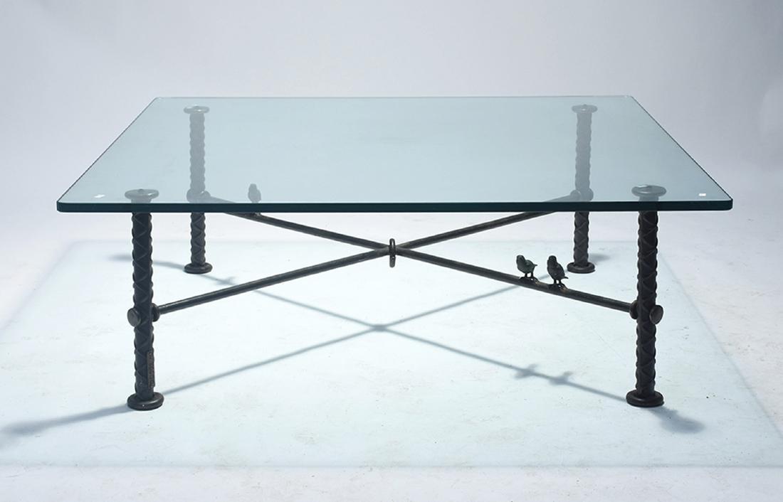 Ilana Goor figural iron coffee table: Ilana Goor figural iron coffee table. Birds perched along stretcher base, glass top 48” square x 17”H., signed with applied tag “Goor”