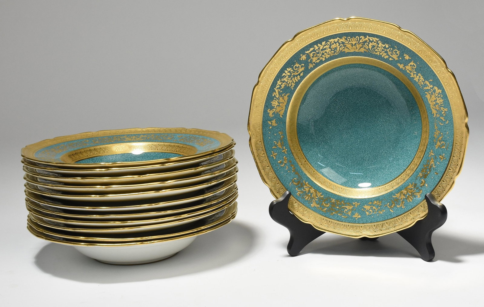 Set of twelve Royal Doulton soup bowls for Ovington's: Set of twelve Royal Doulton soup bowls for Ovington’s New York, gold filigree and banding over turquoise base, 8.75"Dia.
