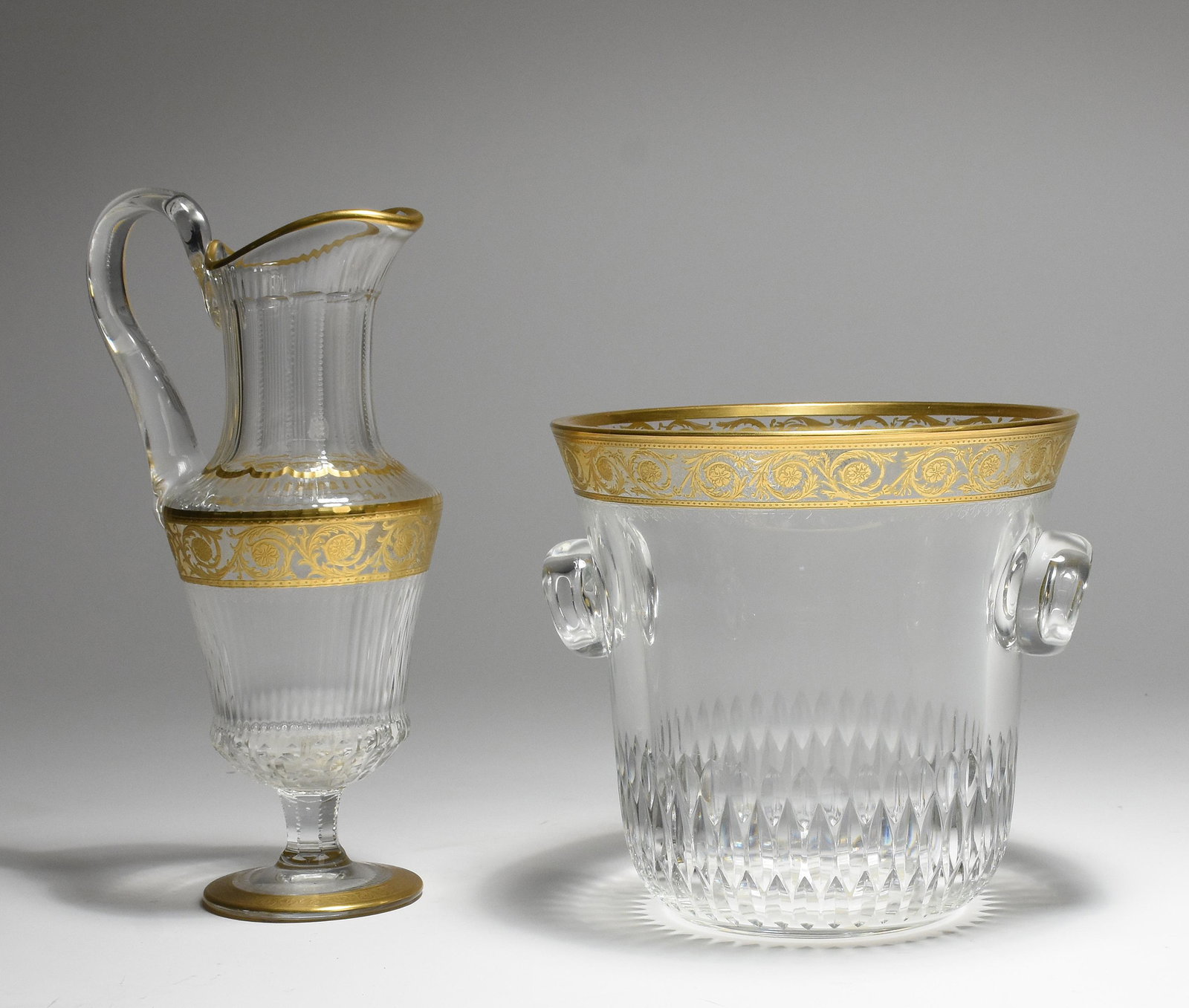 St. Louis wine pitcher with a St. Louis ice bucket: St. Louis wine pitcher, 12.5"H., gilt-cut along with a St. Louis ice bucket, gilt-cut, 8.25"H. X 8.75"D.