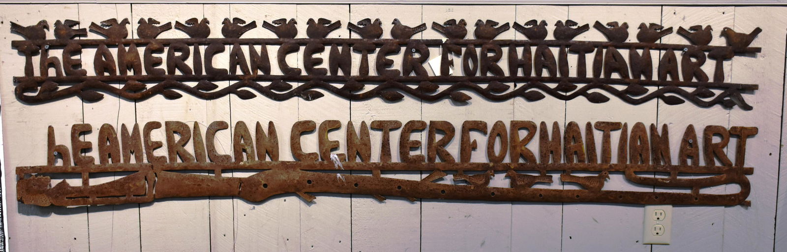 Two pierced metal signs (1 of 3)