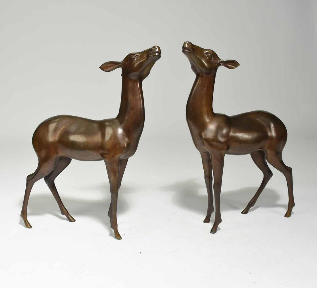 Pair of Bronze Art Deco Fawn Sculptures: Pair of bronze Art Deco fawn sculptures standing with heads raised. Unsigned. 17”L x 23”H x 4.5”W. 14 lbs and 11 lbs.