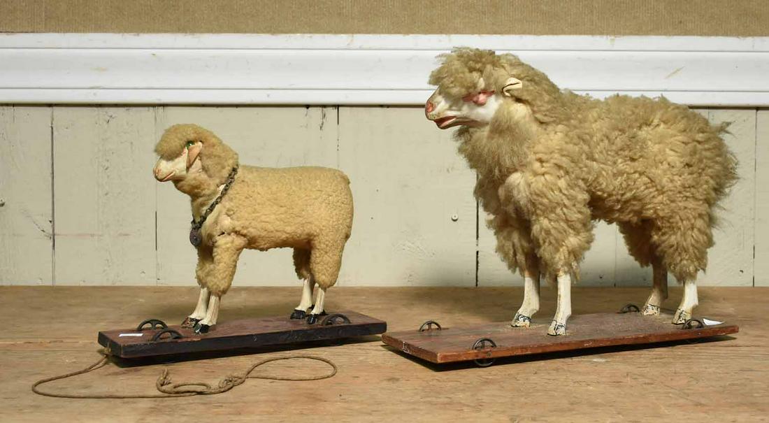 Two 19th Sheep Pull Toys: Two 19th C. sheep pull toys, large sheep 11”H x 13”L, smaller example 8”H x 9”L.