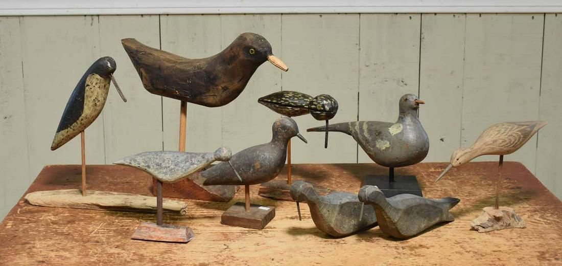 Group of Duck and Shore Bird Decoys: Collection of nine primitive duck and shore bird decoys, ranging in size from 7”L – 15”L, most with original old paint, some with stands