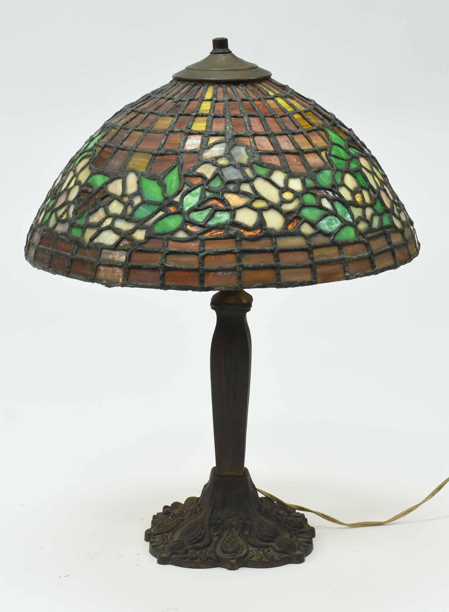 Leaded Glass Table Lamp: Leaded glass table lamp with iron base, 20”H, 16” dia.