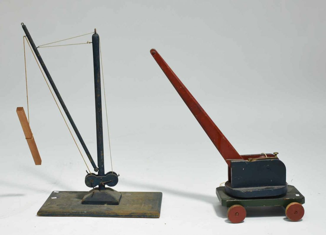 Two Antique Toy Cranes: Two antique wooden crane toys in old paint, 17.5"L x 27”H, and 12’L x 24”H.
