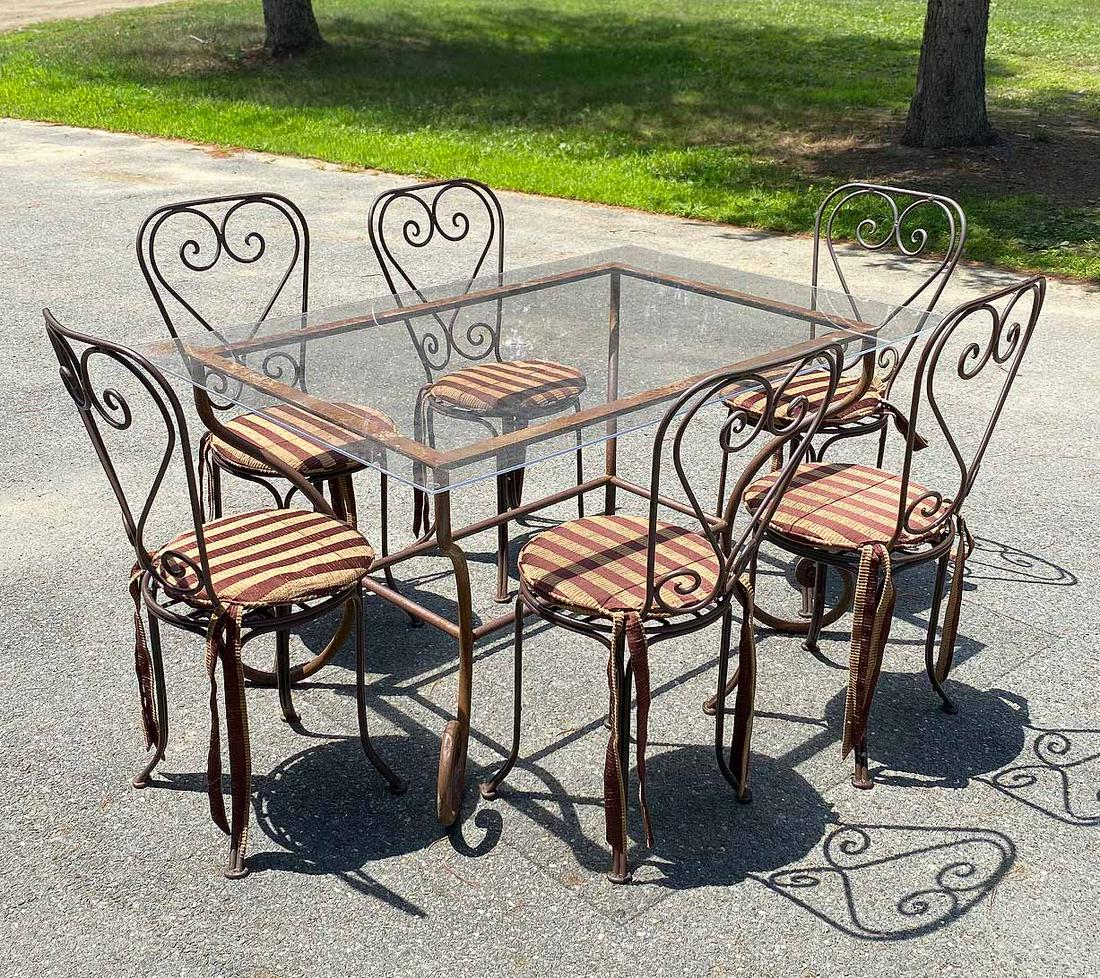 Outdoor Iron Patio Set: Outdoor iron patio set, with six chairs and table. Table: 27.5”H x 31.5”W x 47”L, chair: 37”H, 17” seat height