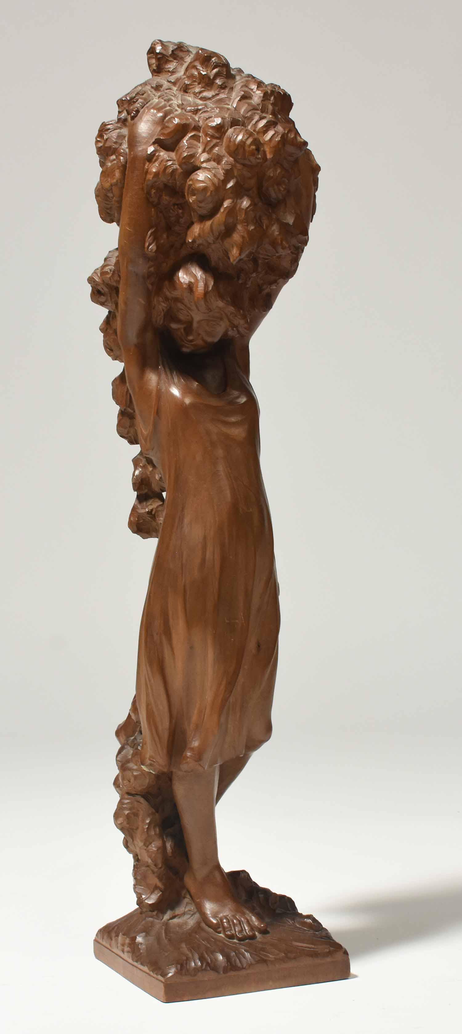 French Art Nouveau Wood Figure: French Art Nouveau carved wooden figure of maiden with basket of flowers, label on bottom, 21"H.