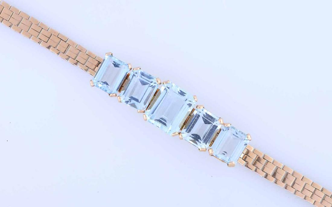 Gold and Aquamarine Bracelet: 14k gold and aquamarine bracelet, retro style set with 5 emerald cut aquas total weight of approx. 23.5 ct., 6"L, 18 grams