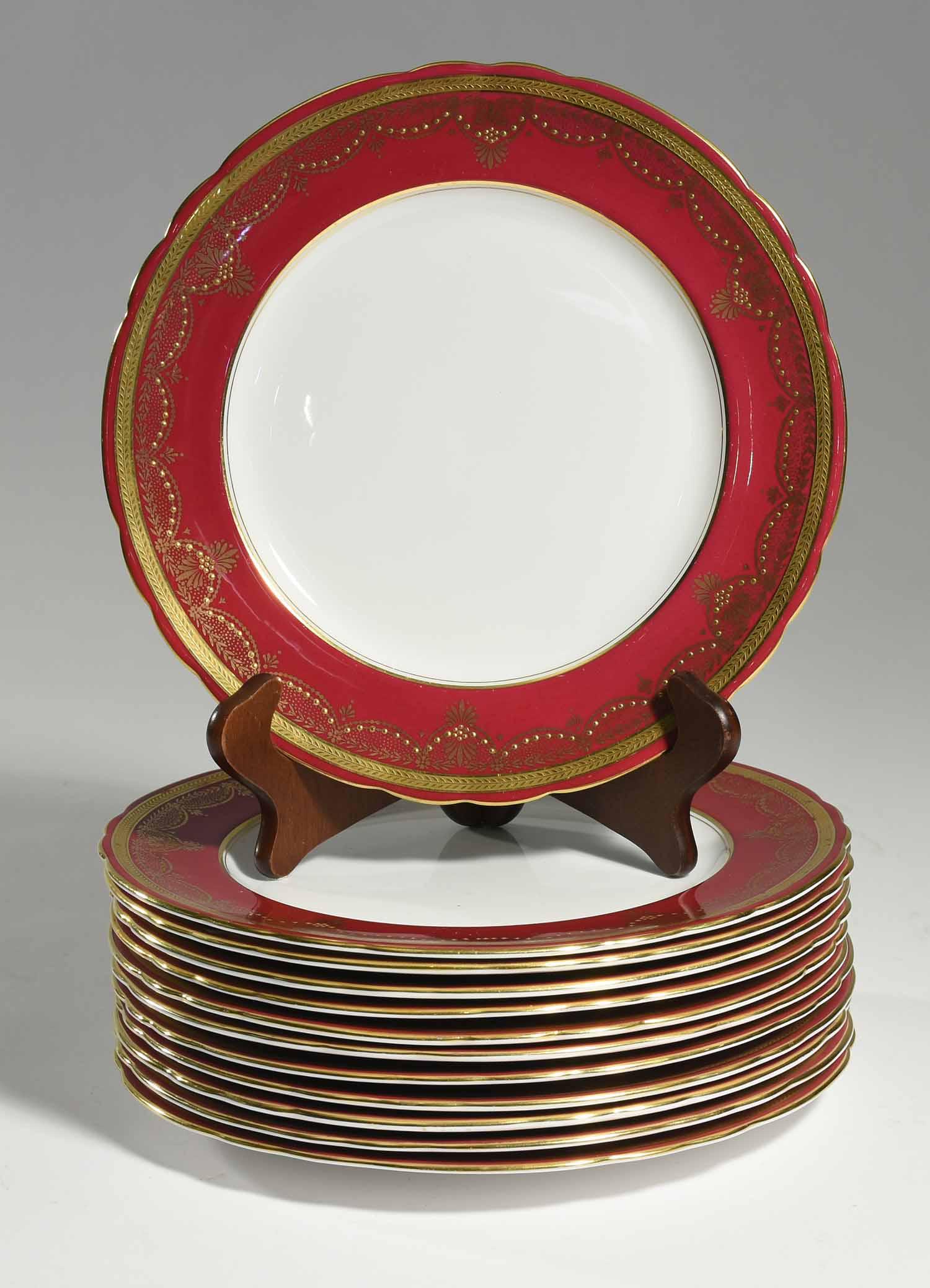 Set of Twelve Aynsley Plates: Set of twelve Aynsley dinner plates with maroon and gilded borders, #7321, 10.25”dia.
