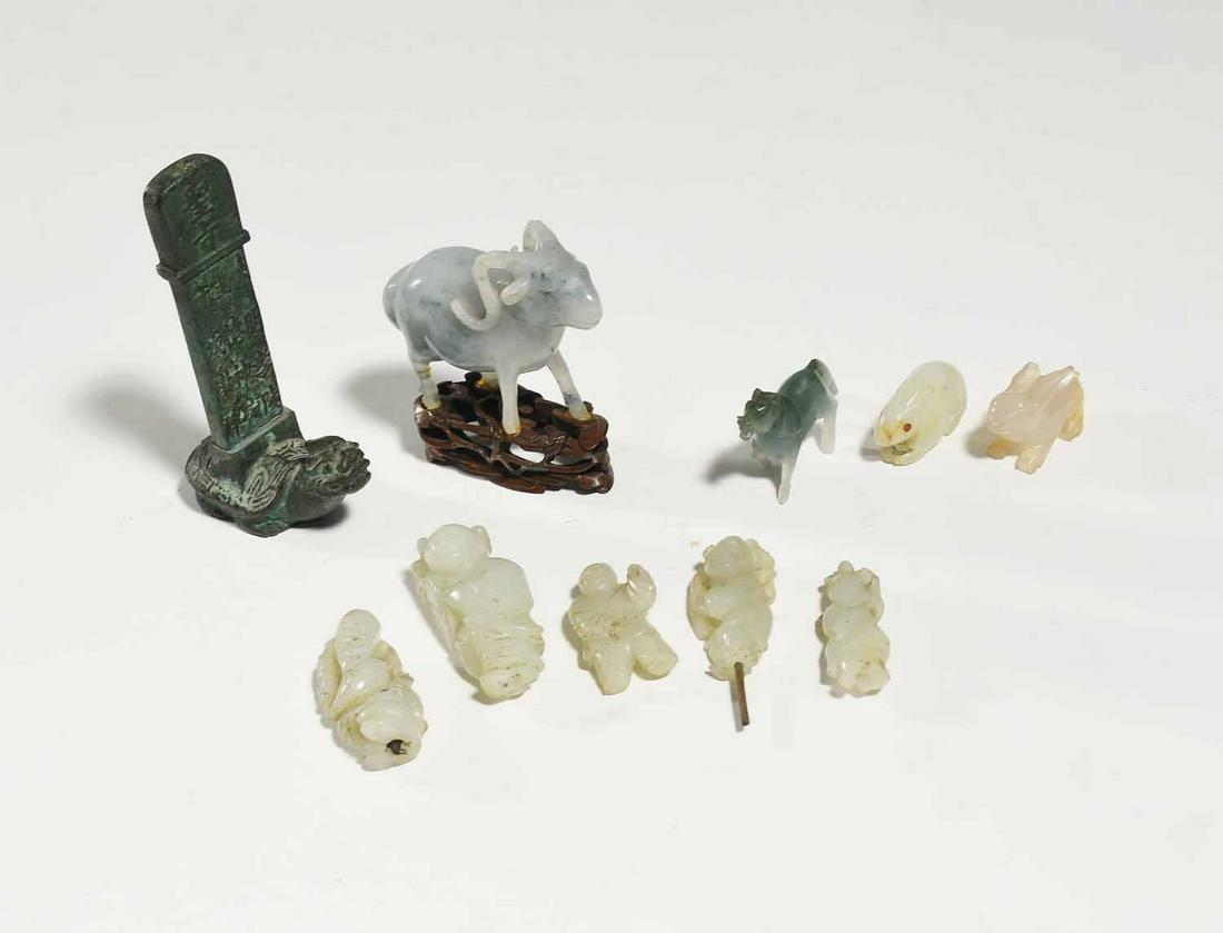 Lot of Small Jade Carvings: Lot of small jade carvings including goat on wooden stand 3”H, five human figures 2-2.5”H, two rabbits, running horse and bronze turtle figure. 10 pieces total.