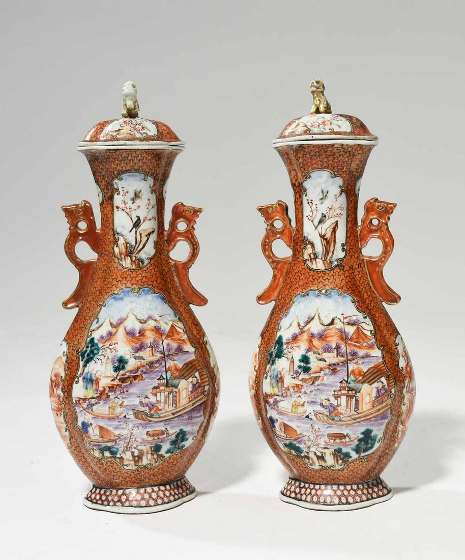 Pair of 18th C. Rose Mandarin Vases: Pair of late 18th C. Chinese export Rose Mandarin handled and lidded vases, hand painted cartouches with harbor scenes, lids with foo dog finials. 11.5”H x 5.5”W. 