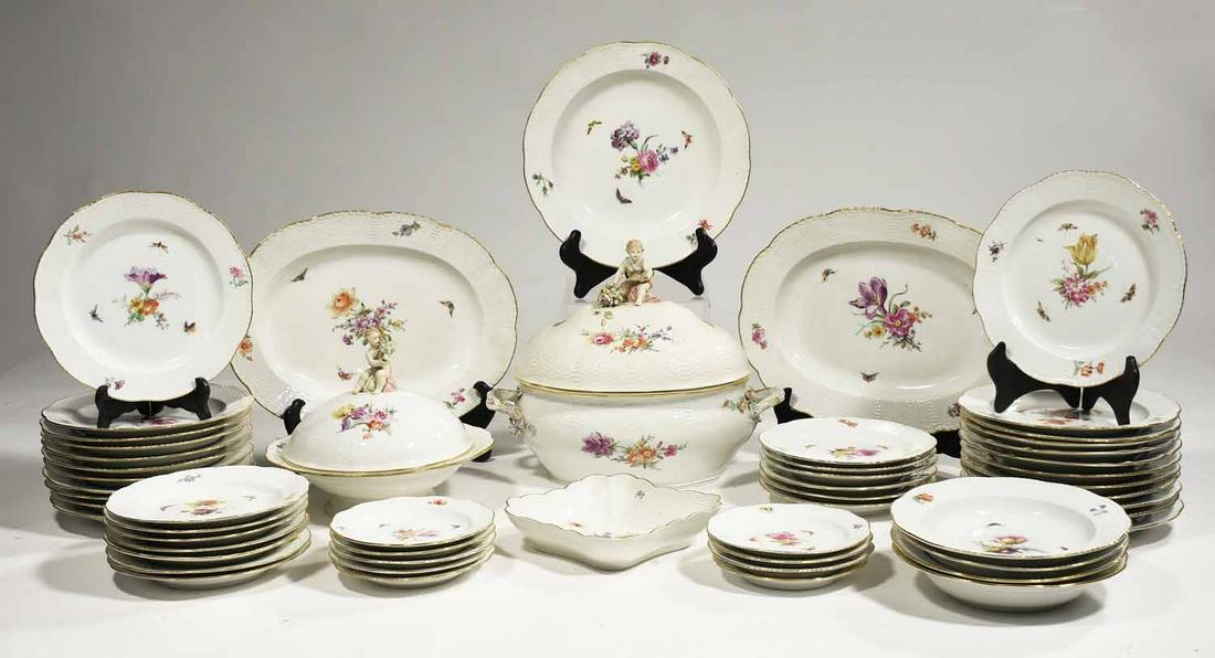 Set of 19th C. KPM Porcelain: Large set of 19th C. KPM porcelain with hand painted floral decoration and basket-weave pattern, including large tureen with figural finial, 15”L x 13”H, lidded serving dish with figural f