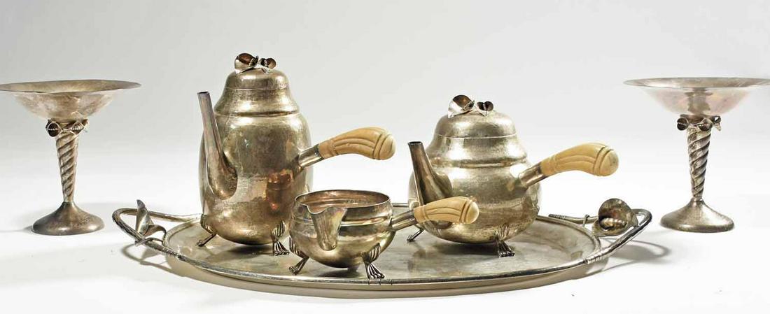 Sterling Silver Tea Set: Six piece sterling tea set, calla lily design, with bone handles, including coffee pot 8”H, teapot 6.5”H, creamer 3”H, handled tray 21.5”L x 13.75”W; along with pair of m
