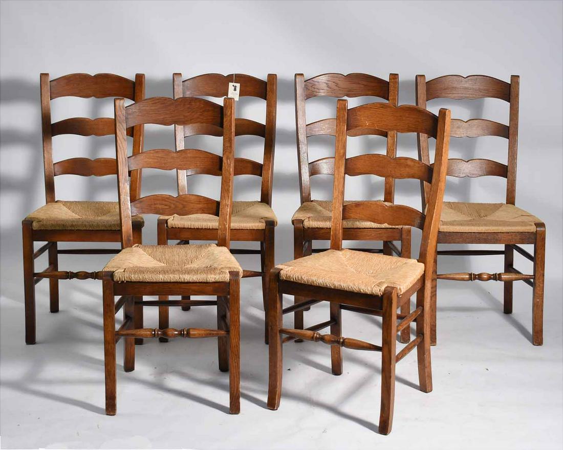Six Country French Chairs: Set of six rush seat country French chairs, with shaped ladder back, removable rush seats, seat height 18"H, overall 35"H. Purchased in 1997 for $550 each.